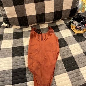 Orange body suit